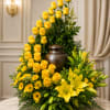Vibrant Yellow Rose wrapping around the center urn.