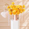 Yellow rose bouquet in a rose-gold box with white ribbons