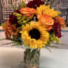Sunflowers, high and magic roses, white hydrangea, butterscotch daisy's, red cremones, solidago