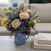 This is a silk arrangement, meaning artificial, not real flowers. These flowers