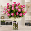 Pink roses and white hydrangeas in a clear glass vase