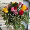 Bouquet of multicolored roses in a glass vase