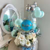 Birthday balloon display with white roses and hydrangeas in a gift box
