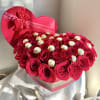Heart-shaped box of red roses with gold-wrapped chocolates