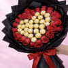 Bouquet of red roses with gold-wrapped chocolates in black paper