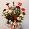 Fall bouquet with carnations, small daisies, pumpkins, and a pumpkin ribbon