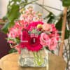 Pink mixed flower bouquet in a clear glass vase
