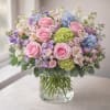Soft pink roses and a lime-green hydrangea cluster make an immediate, romantic