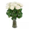 White roses arranged in a clear glass vase