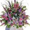 Large mixed bouquet with pink lilies, roses, and purple flowers
