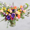 Colorful mixed bouquet in a clear glass vase