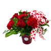 Red roses and carnations in a vase with a heart-patterned ribbon
