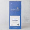 Blue box of dark chocolate bar standing upright on a light gray surface