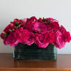 Pink and red mixed bouquet in a rectangular glass vase