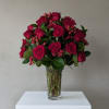 Bouquet of deep pink roses in a clear glass vase