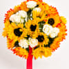 Bouquet of yellow sunflowers and white roses with a red ribbon