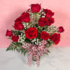 18 Red Roses Vased by Savilles Florist is a splendid presentation of