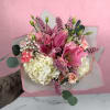 Pink and white bouquet with lilies, hydrangeas, and roses
