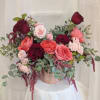 A modern one-sided arrangement with a combination of Garden Roses, Spray Roses
