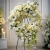 A serene circular wreath arranged for sympathy and funeral settings, the Circle