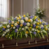 Low, rounded and garden-fresh, this casket piece brings a calm, uplifting presence