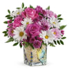 Pink roses and white daisies in a decorative glass vase
