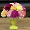A sundae container filled with carnations to look like a scoop of