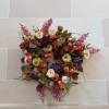 Autumn floral wreath with purple, orange, and cream blooms