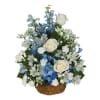 Blue and white floral arrangement in a wicker basket