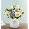 White and blue flower arrangement in a white vase with a cross