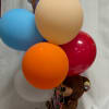 Birthday balloon bouquet with a teddy bear and candy box
