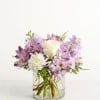 Lavender and white bouquet in a clear glass vase