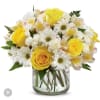 Yellow roses and white daisies in a clear glass vase