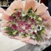 This stunning arrangement features 35, 45, 55 elegant roses at its center