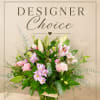 Pink and white mixed flower arrangement in a glass vase