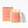 Lit candle in a glass jar with a matching box and lid