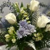 White roses and lavender chrysanthemums in a mixed bouquet