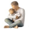 Wooden figurine of a seated adult holding a child