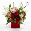 Mixed bouquet of red and pink roses in a red box