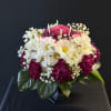 A lively, full-bodied arrangement that reads like a floral celebration-ideal as a