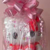 Gift basket with a Hello Kitty plush, wrapped in clear cellophane and pink ribbon