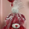 Gift basket with a teddy bear, heart balloon, and love-themed decorations