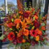 A dramatic autumn centerpiece, this large fall flower arrangement is a bold