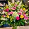 A lush, garden-style bouquet that reads like a sunlit walk through a
