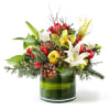Holiday bouquet with lilies, apples, berries, and pinecones in a green glass vase