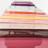 Stack of colorful wrapped floral sleeves or paper sheets