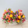 Colorful mixed bouquet in a white textured vase