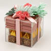 Gift box topped with pink and mint artificial flowers and a ribbon