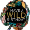 A jumbo mylar balloon shaped like a tropical leaf and decorated with