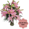Pink lilies arranged in a clear glass vase